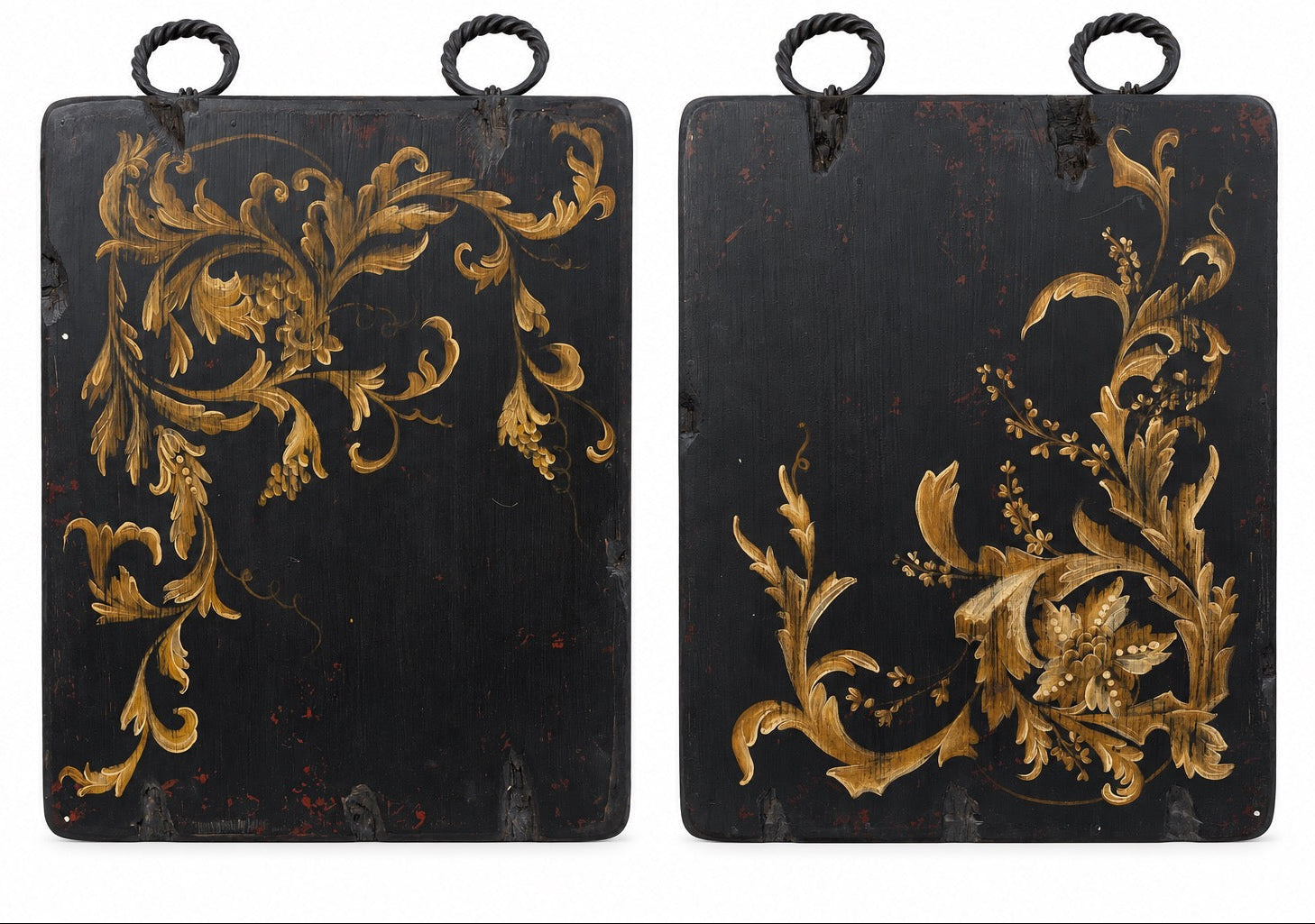 A pair of rectangular black hanging panels or boxes with ornate gold floral scrollwork and hanging loops at the top, shown against a plain white background.