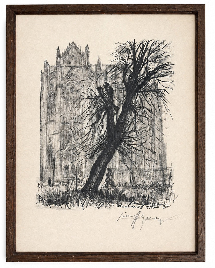 A framed black ink sketch of a Gothic cathedral and a bare tree, mounted on a cream paper background with a dark brown wooden frame.